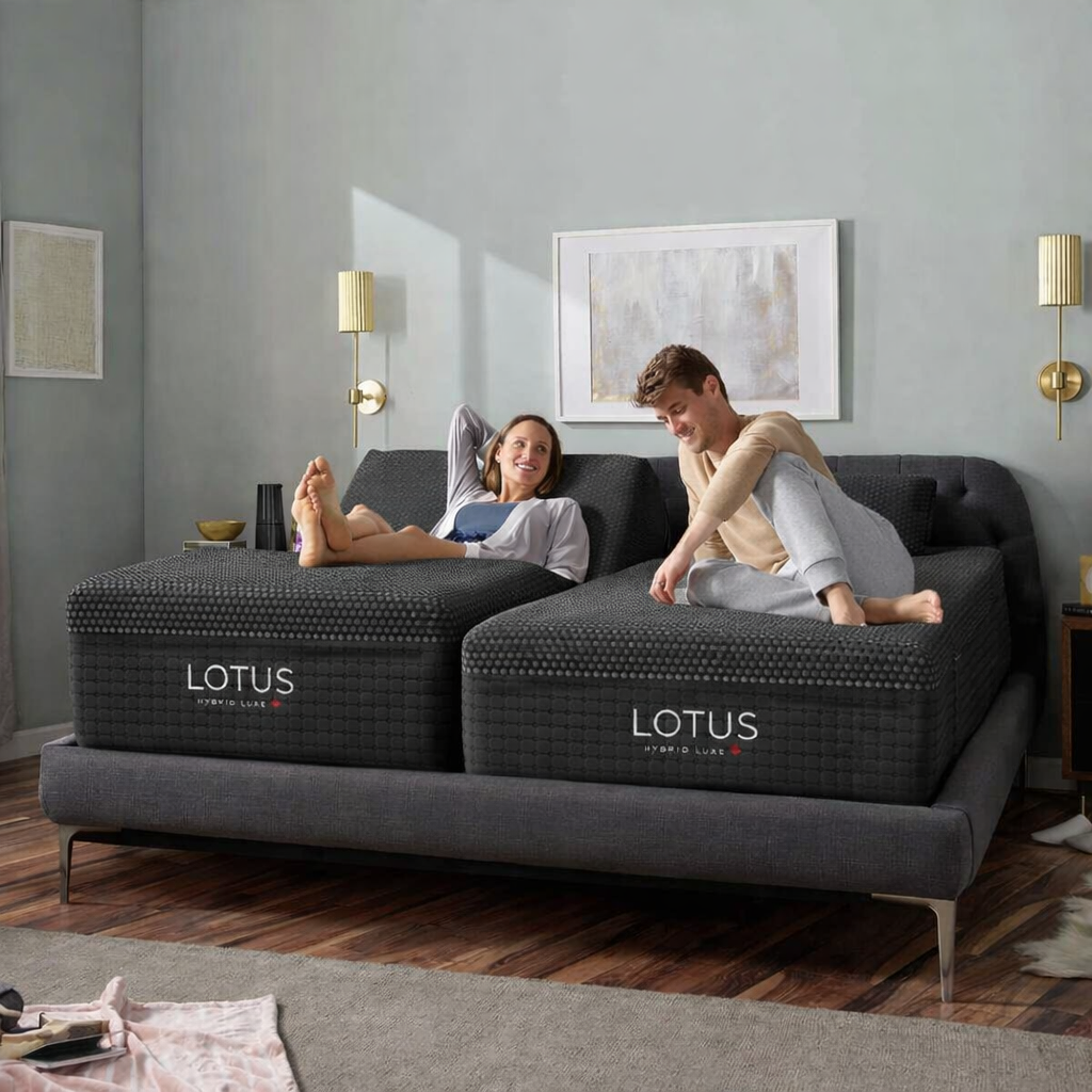 A couple resting comfortably on a Split King sleep system — two independent sides, one bed