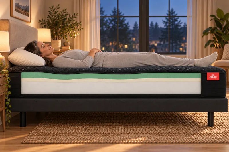 Cutaway illustration of the Luna with a woman lying on her back: green gel memory foam over a cream transition layer and a white support core.